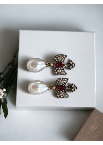 Su Damlası İnci Sallantılı Kırlangıç Figürü Küpe fiyatları