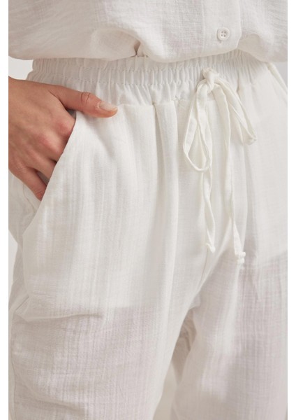 Kadın Ekru Beli Lastikli Havuç Paça Muslin Pantolon fiyatları