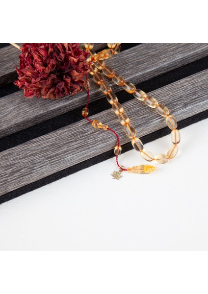 Ateş Kehribar Beyzi Kesim 7X10 mm Tesbih - Şeffaf Uçuk Sarı