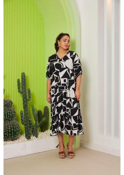 Şıklıkla Rahatlığın Buluştuğu Nokta: Kadın Desenli Büyük Beden Viskon Tiril Tiril Kumaş Siyah Elbise modelleri