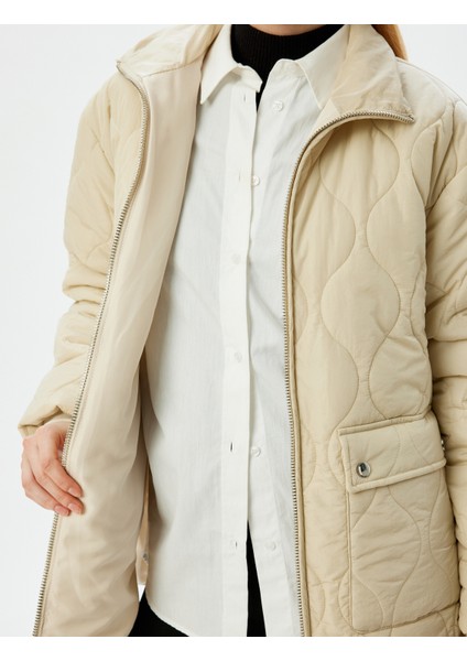 Fermuarlı Cepli Dik Yaka Kapitone Şişme Mont indirimleri