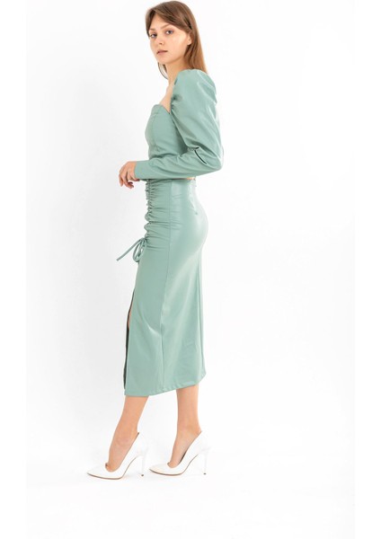 Deri Kumaş Diz Altı Boy Yırtmaçlı Büzgü Detaylı Kadın Etek-Mint modelleri