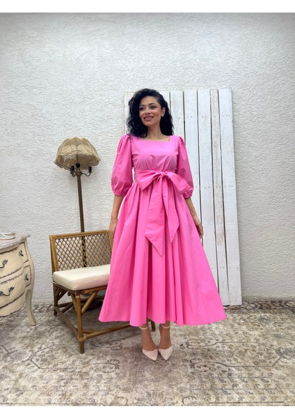 Pembe Uzun Fiyonklu Kloş Poplin Elbise fiyatları