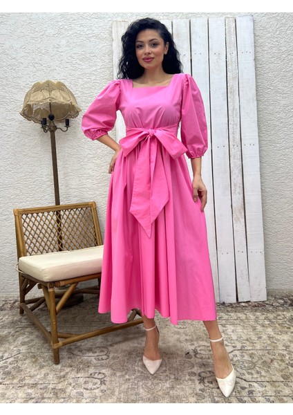 Pembe Uzun Fiyonklu Kloş Poplin Elbise