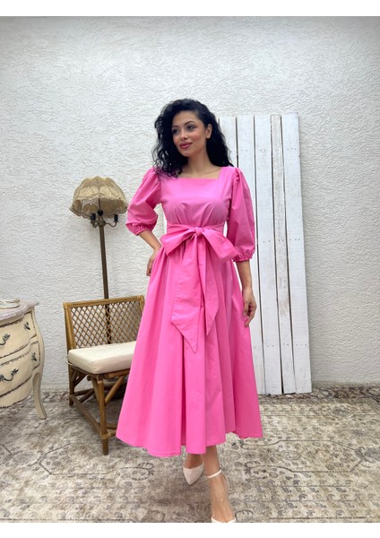 Pembe Uzun Fiyonklu Kloş Poplin Elbise fırsatları