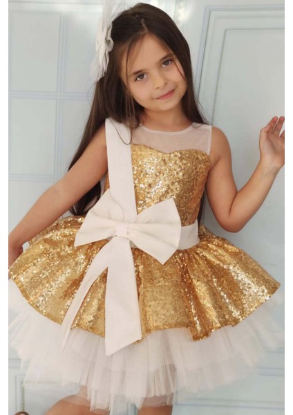 Kız Çocuk Önü ve Arkası Fiyonk Detaylı Üstü Pulpayet Işlemeli Etek Ucu Tüllü Gold Abiye modelleri