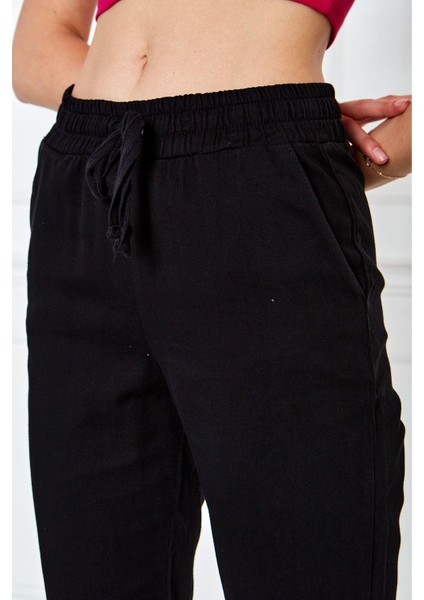 Püsküllü Dar Paça Pantolon
