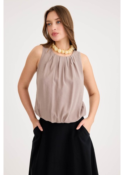 Önü Pileli Sıfır Kol Etek Ucu Lastikli Bluz