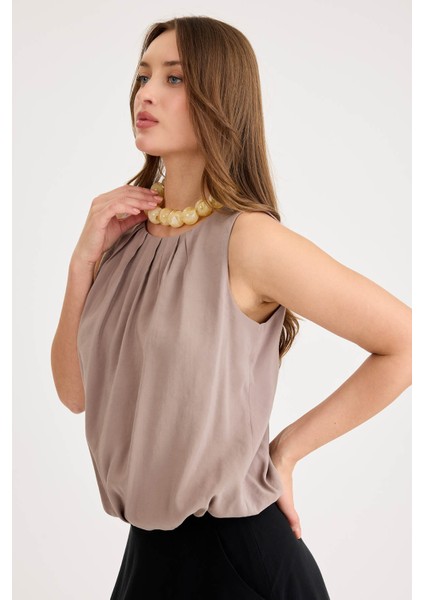 Önü Pileli Sıfır Kol Etek Ucu Lastikli Bluz modelleri