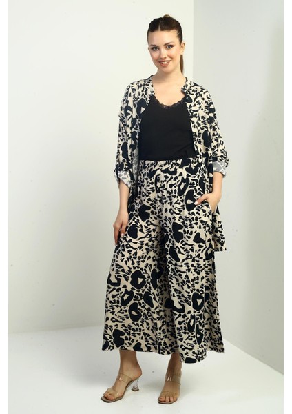 Kadın Yanları Yırtmaçlı Tunik Gömlek Beli Lastikli Cepli Palazzo Pantolon Karışık Desenli Oversize 2'li Takım modelleri