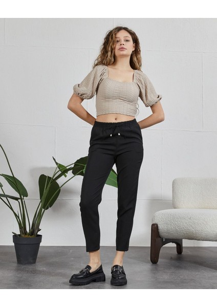 Butikbeli Lastikli Bilek Üstü Havuç Paça Pantolon