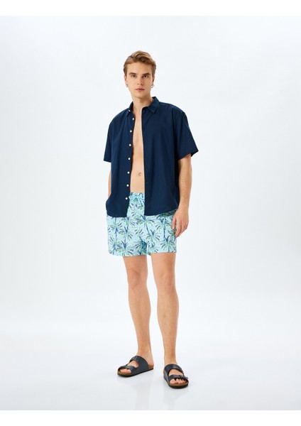 Palmiye Desenli Oversize Beli Bağcıklı Deniz Şortu fiyatları