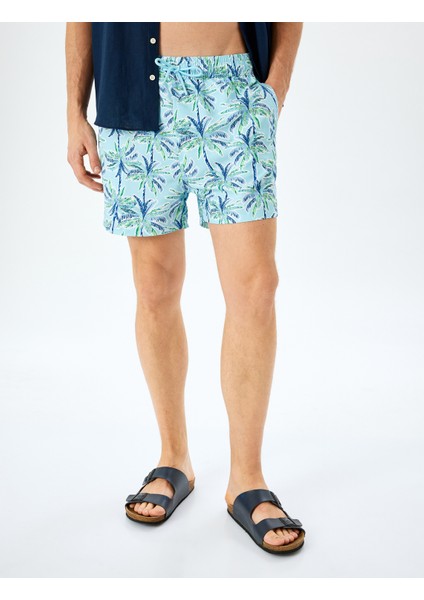 Palmiye Desenli Oversize Beli Bağcıklı Deniz Şortu modelleri