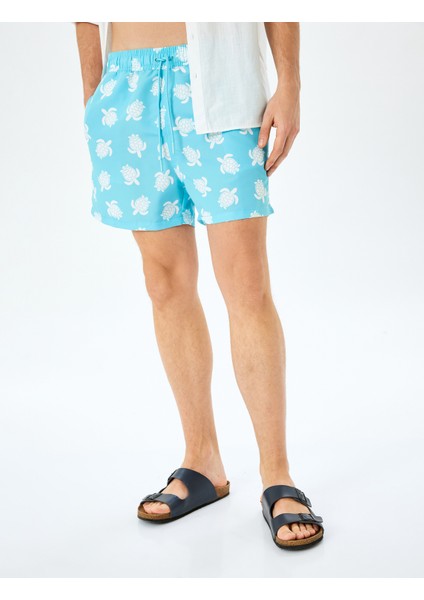 Kaplumbağa Desenli Oversize Beli Bağcıklı Cepli Deniz Şortu modelleri