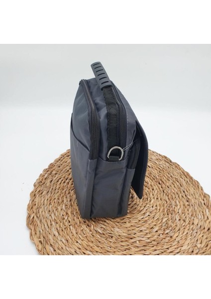 Haki renk yatay fermuarlı orta boy erkek el çantası, şık ve kullanışlı tasarım fiyatları