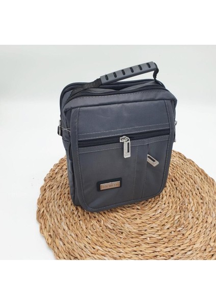 Haki renk yatay fermuarlı orta boy erkek el çantası, şık ve kullanışlı tasarım indirimleri