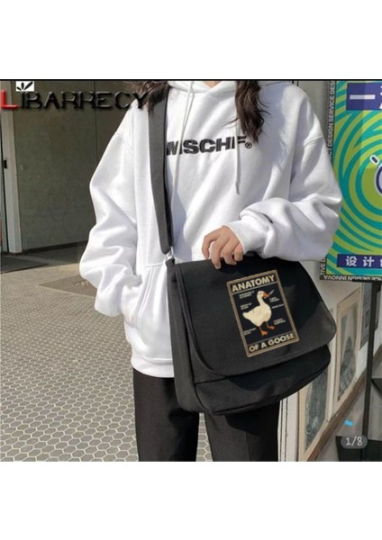 Şık ve kullanışlı siyah postacı çantası, günlük taşıma aksesuarı