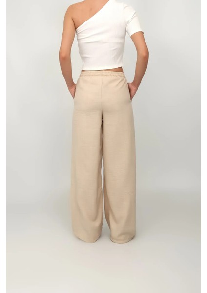 Kadın Bej Renk Beli Lastikli Geniş Paça Keten Pantolon modelleri