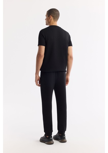 Erkek Siyah Beli Lastikli Bağcıklı Bi-Stretch Regular Fit Eşofman Altı A51Y3412 modelleri