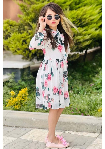 Kız Çocuk Yakası Bağlama Detaylı Üzeri Gül Desenli Piliseli Beyaz Elbise fiyatları