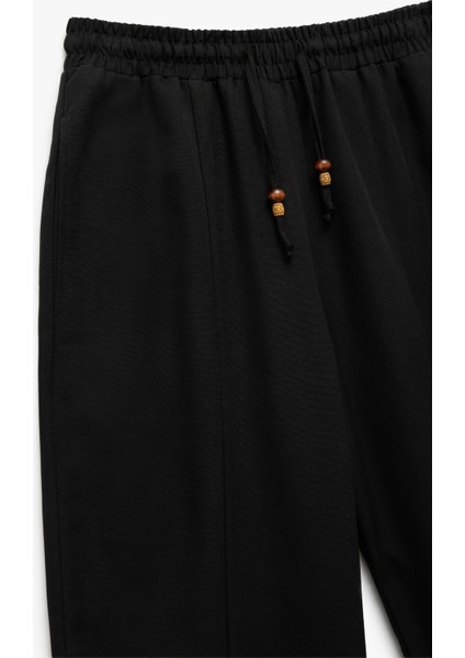 Astarlı Rahat Kalıp Beli Bağcıklı Balon Fit Keten Pantolon