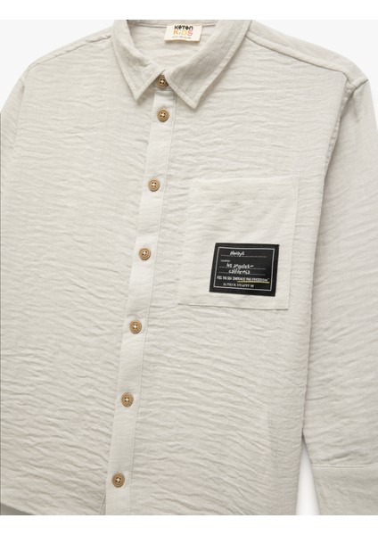 Uzun Kollu Düğmeli Klasik Yaka Cep Detaylı Etiket Baskılı Gömlek modelleri