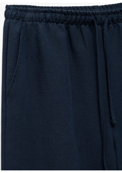 Yüksek Bel Bağcıklı Keten Karışımlı Cep Detaylı Pantolon indirimleri