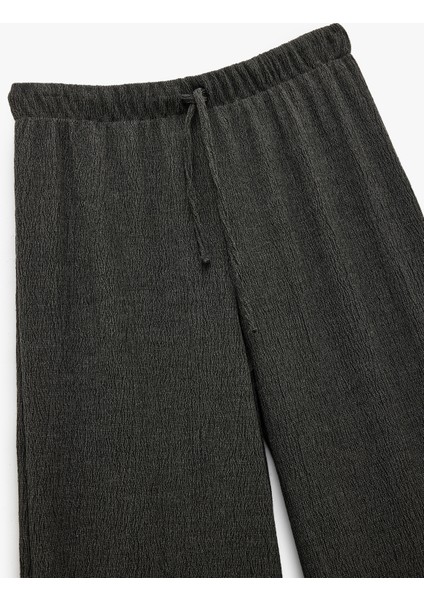 Bürümcük Kumaş Bağlama Detaylı Geniş Paça Pantolon
