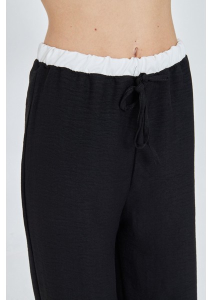 Beli Garnili Bağcıklı Keten Görünümlü Pantolon fiyatları