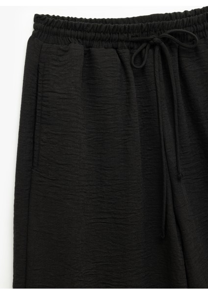 Beli Bağlamalı Lastikli Cepli Rahat Kesim Geniş Paça Pantolon modelleri