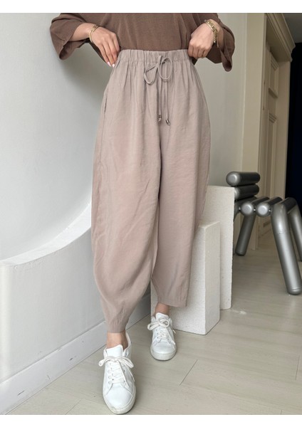 Bej Beli Lastikli Paça Detaylı Cepli Pantolon fiyatları