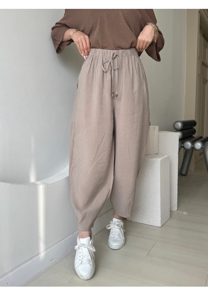 Bej Beli Lastikli Paça Detaylı Cepli Pantolon modelleri