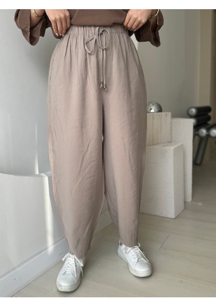 Bej Beli Lastikli Paça Detaylı Cepli Pantolon fırsatları