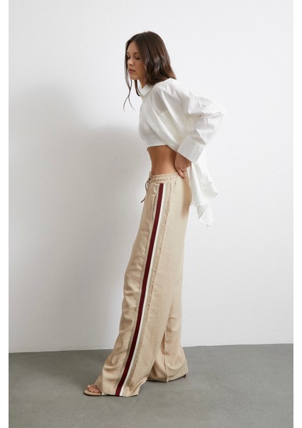 Beli Lastikli Çift Şeritli Pantolon Bej fırsatları