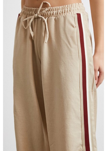 Beli Lastikli Çift Şeritli Pantolon Bej indirimleri