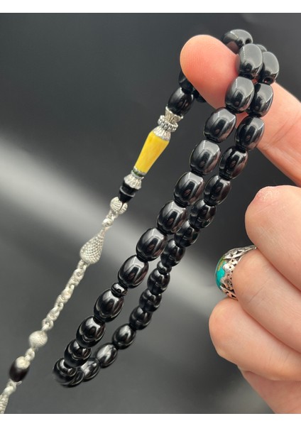 SK0250300.270425 Sıkma Kehribar Tesbih - Siyah Kapsül Kesim, Metal Püsküllü, 9X11 Mm, Koleksiyonluk fiyatları