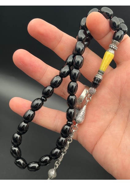 SK0250300.270425 Sıkma Kehribar Tesbih - Siyah Kapsül Kesim, Metal Püsküllü, 9X11 Mm, Koleksiyonluk fırsatları