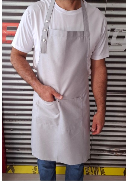 Açık gri, ayarlanabilir askılı, sıvı geçirmez ve leke tutmaz şef önlüğü (70x80 cm) indirimleri