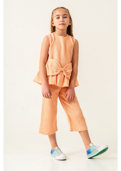 Müslin Pamuklu Fiyonk Detaylı Kız Çocuk Kapri 2 li takım - Turuncu