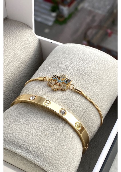 Mavi Taşlı Asansörlü Kar Tanesi Bileklik ve Gold Renk Kelepçe Konbini