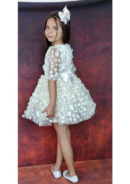 Kız Çocuk Kolları Şeffaf Tüllü ve Üzeri Papatya Motifli Beli Şerit Detaylı Krem Elbise modelleri