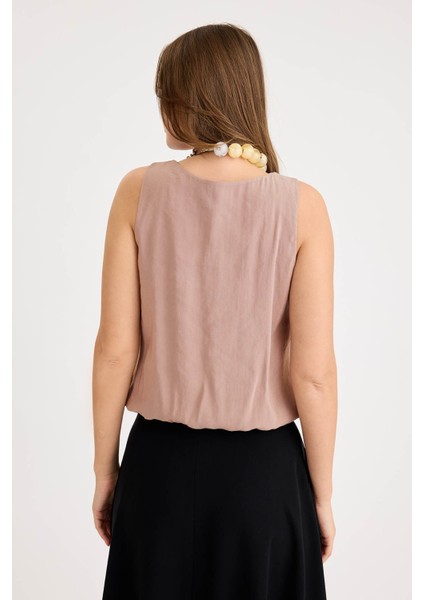 Önü Pileli Sıfır Kol Etek Ucu Lastikli Bluz fırsatları