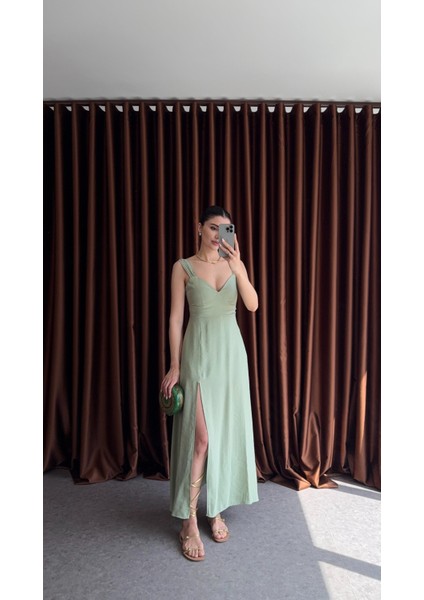 Yırtmaçlı Çağla Yeşili Uzun Elbise