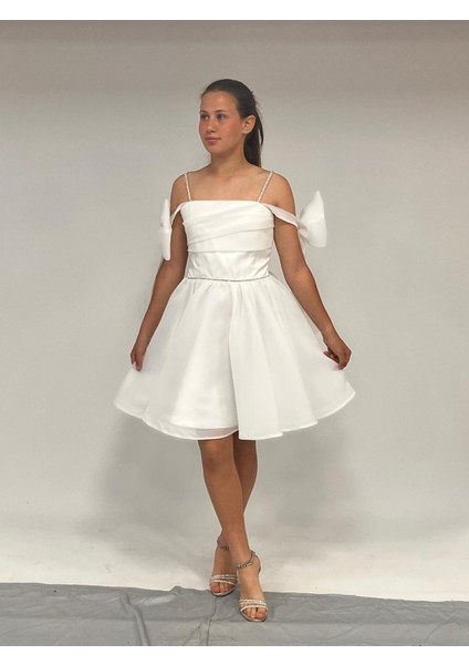 Kız Çocuk Abiye Beyaz Şifon Şerit Taş Askılı Kolları Düşük Fiyonk Detaylı Kısa Abiye Elbise 10-15 Yaş fiyatları