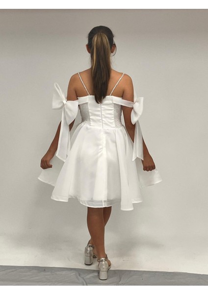 Kız Çocuk Abiye Beyaz Şifon Şerit Taş Askılı Kolları Düşük Fiyonk Detaylı Kısa Abiye Elbise 10-15 Yaş indirimleri