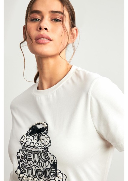 Ekru Pamuklu Inci ve Fiyonk Detaylı Bisiklet Yaka Kısa Kollu T-Shirt fırsatları