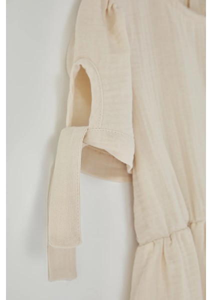 Kız Çocuk Kolu Bağlamalı Örgü Çiçek Detaylı Müslin Elbise modelleri