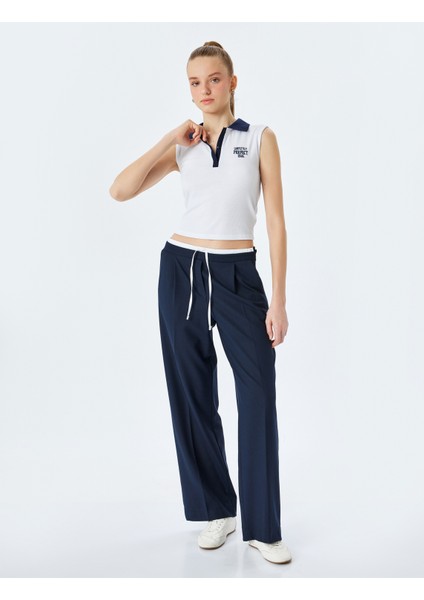 Yeni Sezon Slim Fit Polo Yaka Kolsuz Kolej Işlemeli Üst