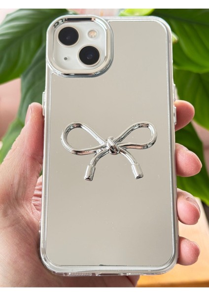 Apple iPhone 15 Uyumlu Kılıf Aynalı Gümüş 3D Fiyonk Desenli Darbe Emici Silikon Kapak modelleri