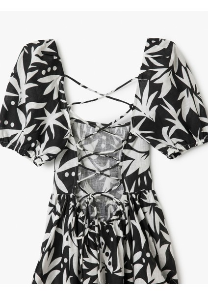 Pamuklu Kısa Balon Kollu Arkası Dekolte Detaylı Midi Boy Çiçekli Elbise indirimleri